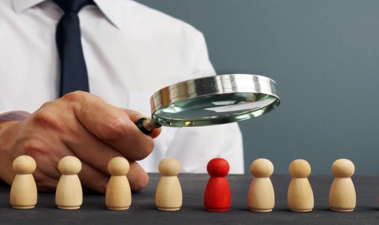see people by a magnifying glass