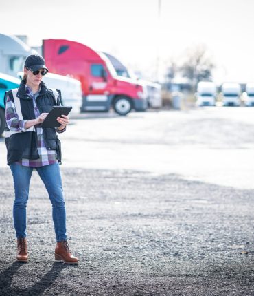 woman blue collar truck driver or transportation s D73RNKC 1 scaled